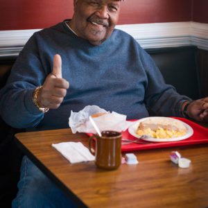 Satisfied customer gives thumbs up about southern breakfast at Mamies